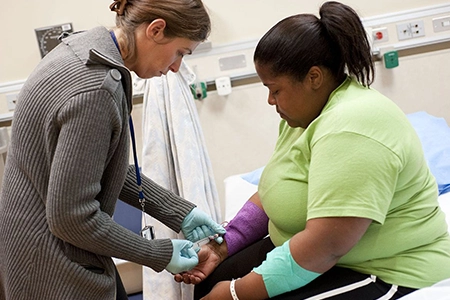 Fat-Burning Amino Acid IV for Energy & Metabolism Boost Nurse administering fat-burning amino acid IV therapy to support metabolism and lean muscle